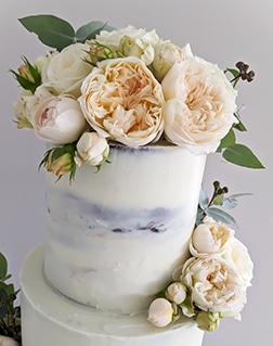 Semi-naked rustic wedding cake with David Austin roses